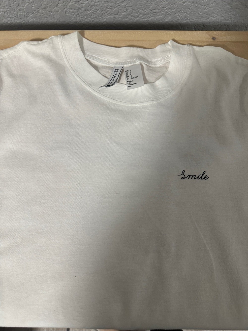 Divided White Tee with 'Smile' Script